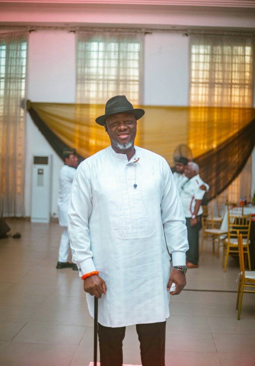 A man poses for a photo at an event