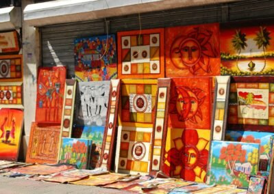 a number of paintings on display near a building